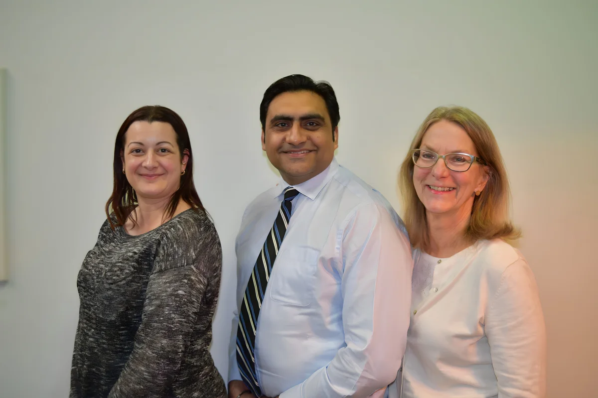 Sukh Sandhu with the team — photograph 1