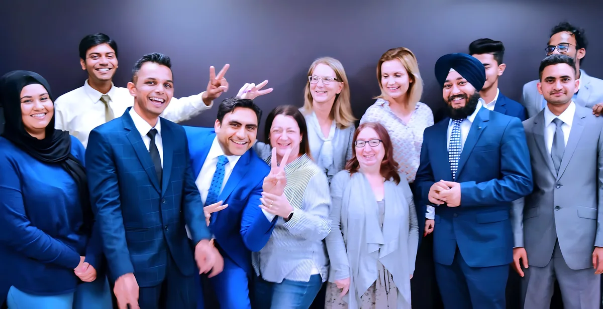 Sukh Sandhu with the team — photograph 6
