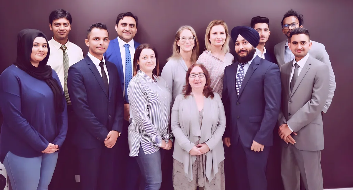 Sukh Sandhu with the team — photograph 7