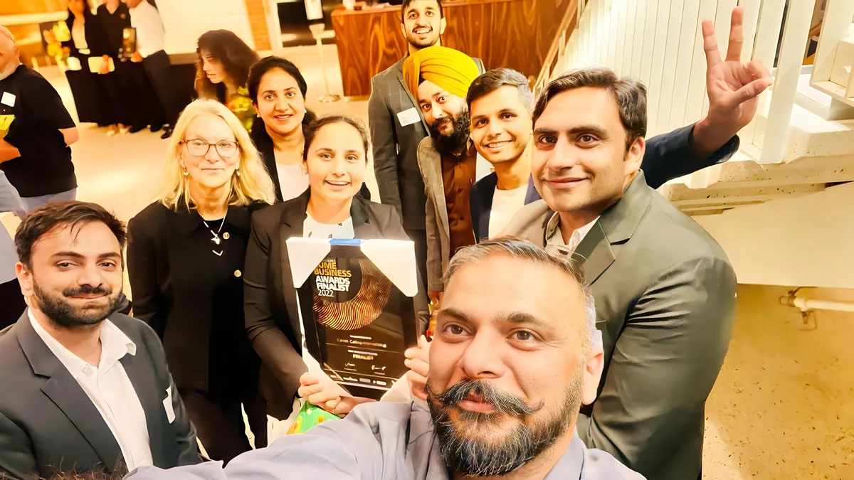 Sukh Sandhu with the team — photograph 11