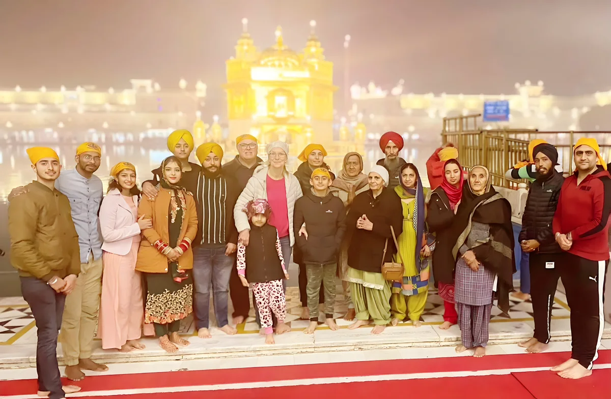 Sukh Sandhu with the team — photograph 12