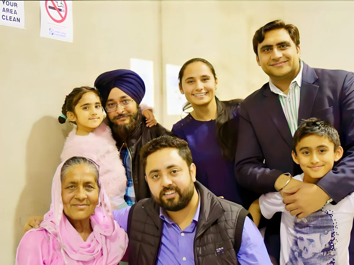 Sukh Sandhu with the team — photograph 13
