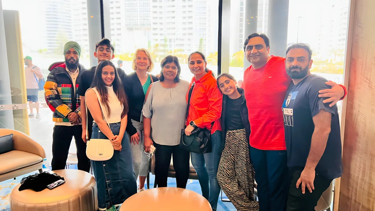 Sukh Sandhu with the team — photograph 20