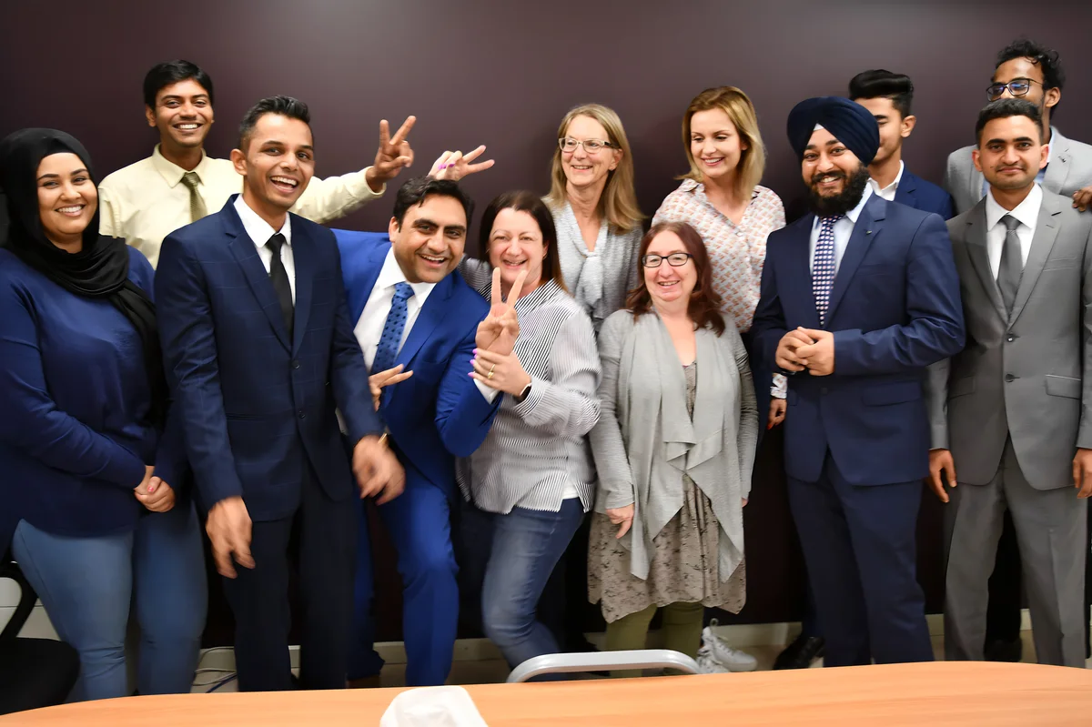 Sukh Sandhu with the team — photograph 21